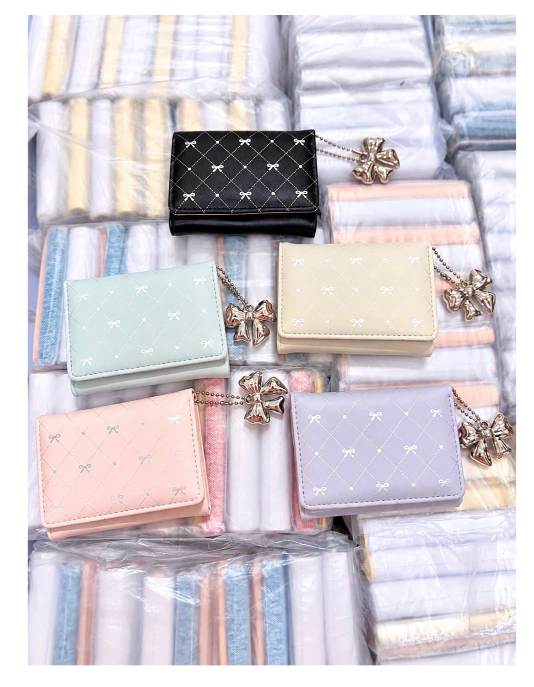 VÍ CẦM TAY CHARM NƠ BẠC
